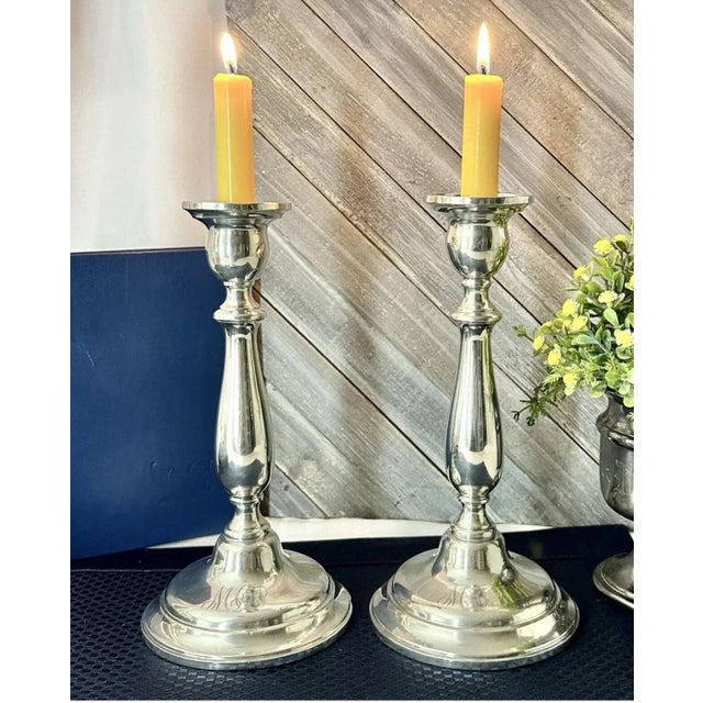 This is for a pair of Monogramed Sterling Silver Candle Holders. The maker is International Silver in the Lord Saybrook...