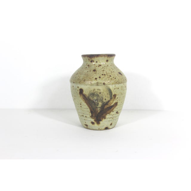 Stunning mid century modern handmade and signed speckled stoneware vase. Rustic and natural. Has an indent in the pattern...