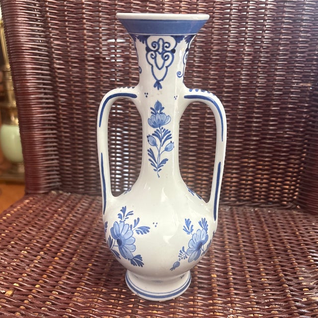 This is a vintage Blue Royal Delft vase made by De Porceleyne Fles, featuring ornate handles and hand-painted floral...