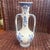 This is a vintage Blue Royal Delft vase made by De Porceleyne Fles, featuring ornate handles and hand-painted floral...