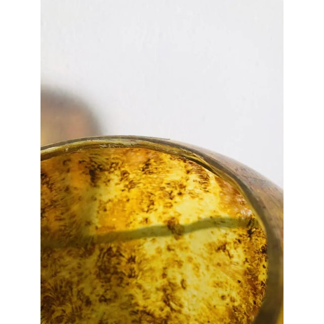 Small chip on the upper inner edge.