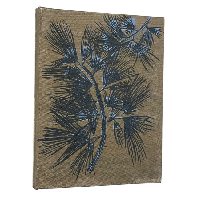 Wall art featuring a stylized branch and needle motif. The composition is rendered in black with light blue accents...
