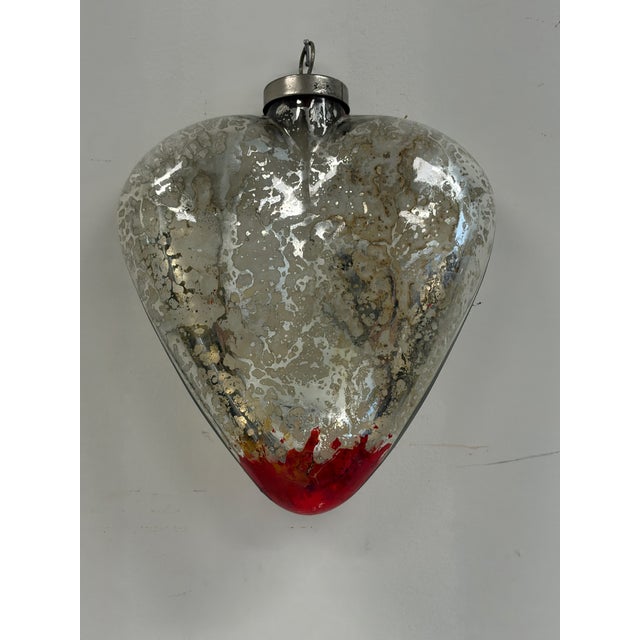 Decorative heart ornament in the style of a French Sacré Cœur or ex-voto heart. Made of molded glass with a distressed...
