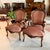 Pair of vintage walnut armchairs in the Louis XV-style with professionally upholstered striped seats and backs in a muted...