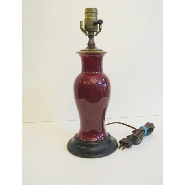 Antique oxblood vase mounted as table lamp later. Fine quality porcelain in rich deep Burgandy color oxblood. Electrical...