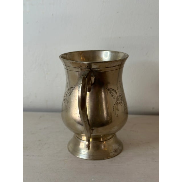 A lovely vintage English tankard in Silverplate. Delicate etched detail. Hand sourced in and imported from England.