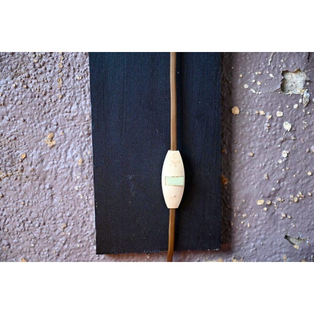 This light fixture perfectly reflects a certain Scandinavian lifestyle. The light source is supported by a double movable...