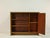 This elegant vintage bookcase from the 1950s combines functionality with classic mid-century design. The warm look of the...