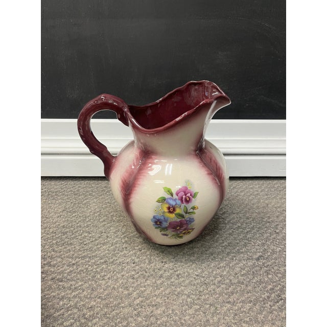 This is a beautiful, large set of a pitcher and wash basin. The pitcher is decorated with a beautiful, rich floral design...