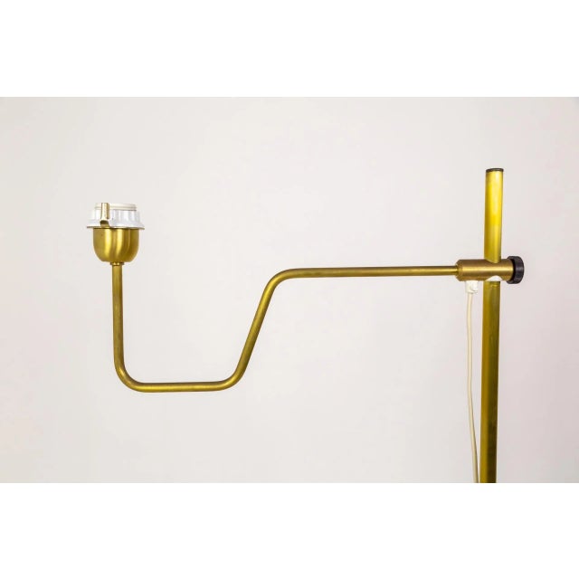 A pair of adjustable brass floor lamps by Markaryd in Sweden; designed by Hans Agne Jakobsson in the mid-20th century....