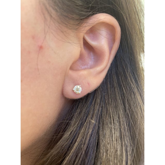 Classic natural diamond stud earrings, by Alexander Beverly Hills. Two matching round brilliant diamonds 0.87 carats...