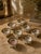 A complete and charming set of eight antique Japanese open salt cellars, each marked “Hand Painted NIPPON” — placing their...