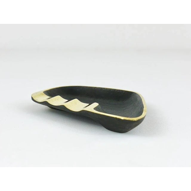 A stylish modernist ashtray with amazing asymmetrical shape. Designed by Walter Bosse, executed by Hertha Baller Austria...