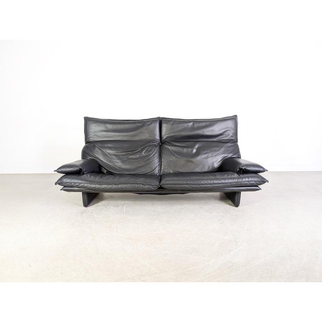 Beautiful vintage Italian sofa from the 1980s. This two-seater features adjustable headrests and is exceptionally...