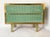 Elegant 1970s vintage cabinet with fluted sage green Murano glass doors, a brass frame, and a marbled glass top. The clean...