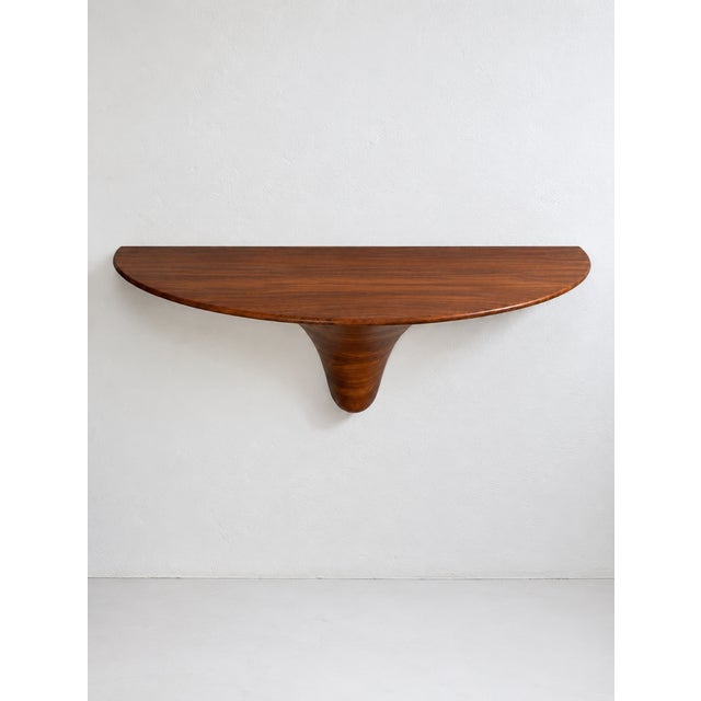 An exceptional, monumental wall-mounted console designed by Marc Van Rampelberg for Rampel Designs. The piece features a...