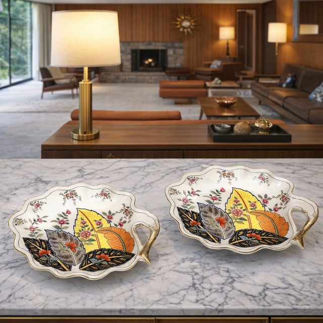 Offering a pair of vintage Chinese porcelain tobacco leaf trays or catchalls signed on bottom by C. Mann. The pair of...