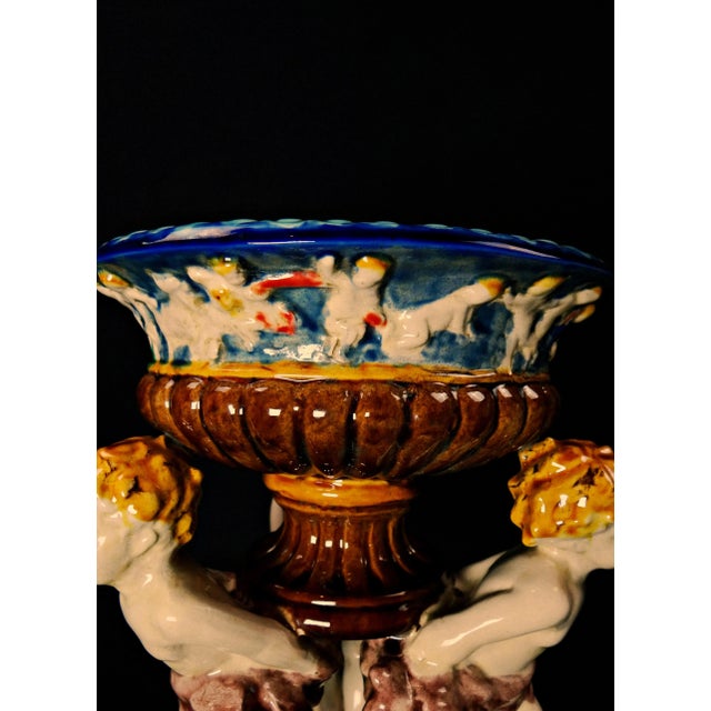 Polychrome slip tripod basin with putti decoration in the Minton style, 19th century How about inviting the charm of neo-...