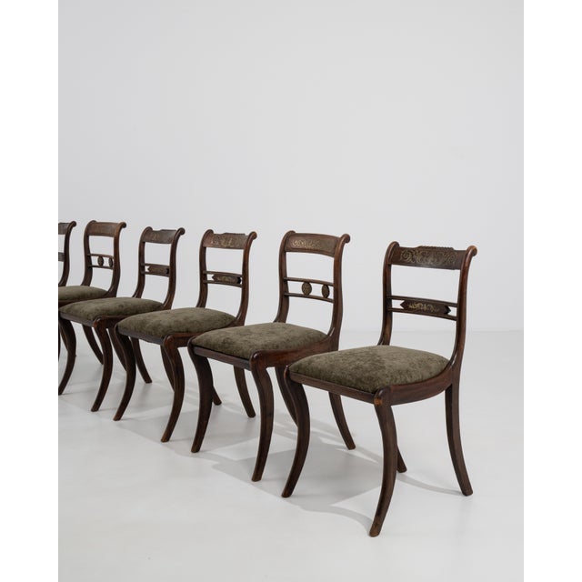 A distinguished set of six Regency sabre-leg dining chairs, crafted in early nineteenth-century Britain at the height of...