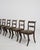 A distinguished set of six Regency sabre-leg dining chairs, crafted in early nineteenth-century Britain at the height of...