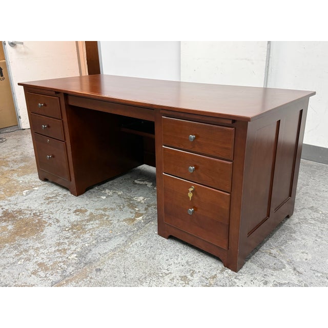 Design Plus Gallery presents an Executive Desk from Stuart David. This desk is presented in a dark cherry finish with a...