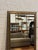 Design Plus Gallery presents a Custom Full Length Mirror. A rectangular silhouette, an antiqued gilt-toned frame, and a...