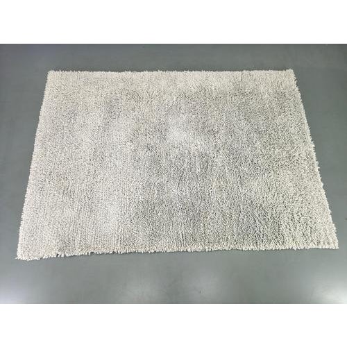 A refined Danish wool rug designed and produced by C. Olesen in the 1990s, showcasing the essence of Scandinavian...