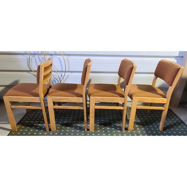 4 Baumann chairs in solid beech. Very comfortable. This piece has an attribution mark, I am sure that it is completely...