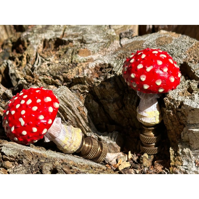 These whimsical lamp finials are crafted from cast resin mushrooms mounted on knurled bronze bases sized to fit a...