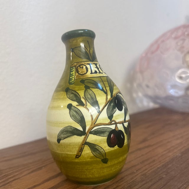 Add a touch of Mediterranean charm to your kitchen counter with this gorgeous, authentic Italian ceramic olive oil...