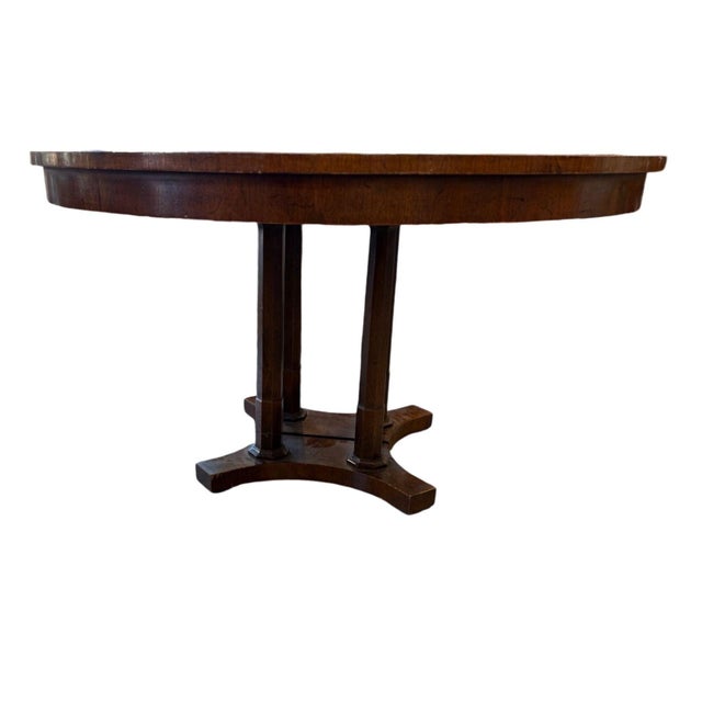 The pedestal Mahogany top which separates into two pieces with ability to expand, but no leaves,