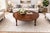 A beautifully proportioned and structurally honest American drop-leaf coffee table, manufactured by Tryner-Fletcher Co. of...