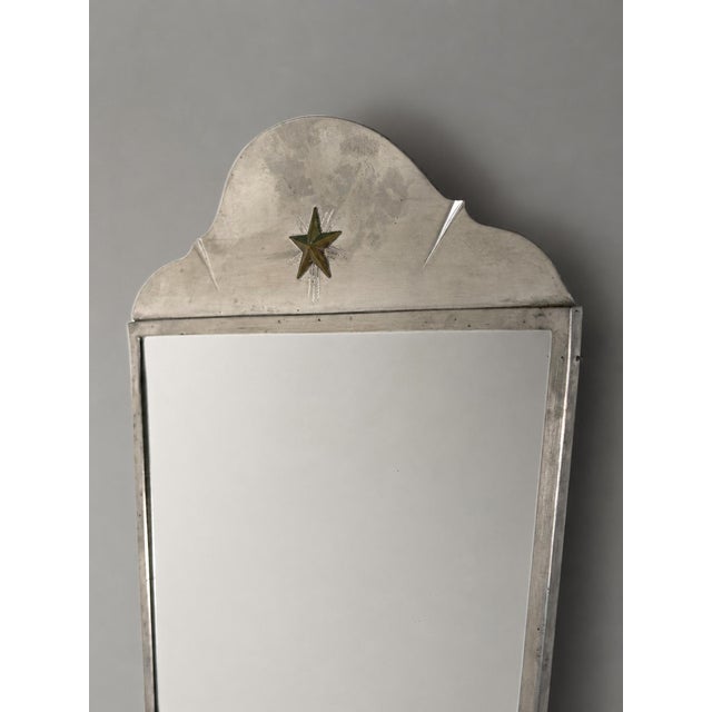 Jacob ängman for gab, pewter mirror, sweden, 1930s a mirror designed not merely to reflect a room, but to give it...