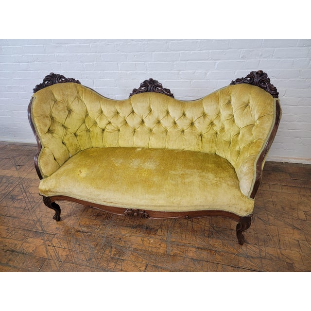 Antique Yellow Loveseat With Carved Wood and Tufted Yellow Velvet