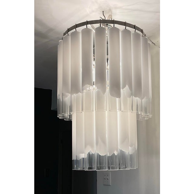 Modernist classic 2 tier glass tube chandelier with 38 frosted opal and clear tubes on a chrome rack. Each glass tube is...