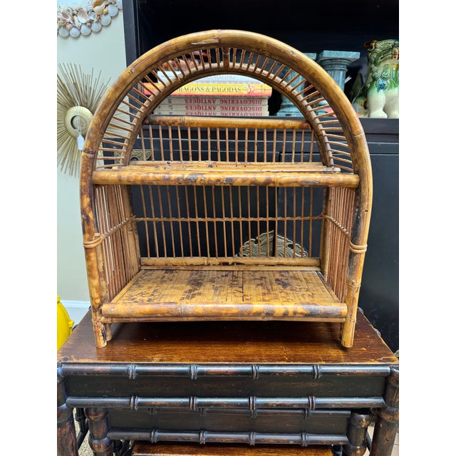 This burnt bamboo shelf is as charming as it is useful! The shelf can stand on a tabletop or be hung on the wall. The...