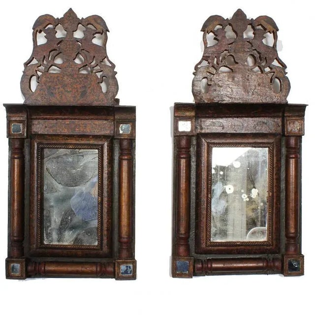 An important pair of carved and painted courting mirrors with soulful patina. An interesting combination of French form...