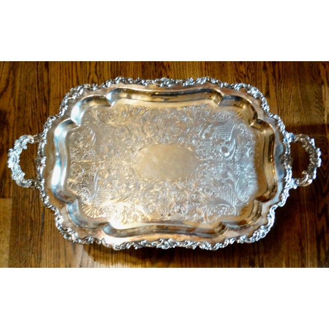 Handsome impressive size rectangular silver plate serving tray platter with twin handles. It has an ornate stepped...