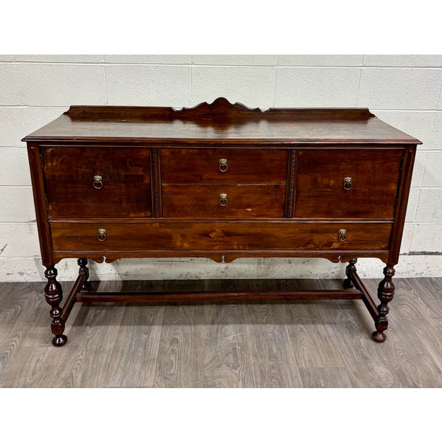 This is a stunning vintage, possibly antique, Jacobean or Tudor Revival style carved sideboard, server, console, or...