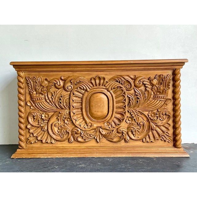 This exceptional vintage dry bar is a masterful display of ornate wood craftsmanship, offering both sculptural beauty and...