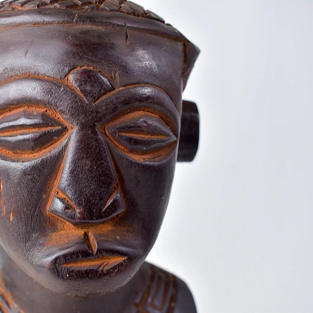 This Ndengese Figure from Congo is a remarkable Ndengese sculpture, portraying a dignified and authoritative male with...