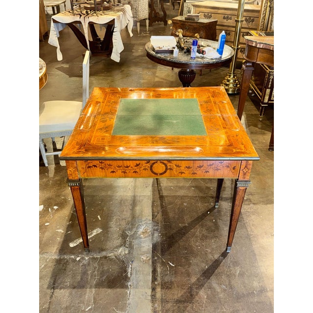 This 19th c. French Inlaid Games Table features mahogany, maple and satinwood. Featuring a gorgeous inlaid pattern and a...