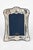 Sterling silver picture frame made by Ron Carr Ltd. Sheffield. The frame has an ornate scrolling foliage designs...