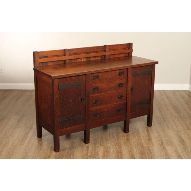 High Quality Antique Eight Leg Oak Sideboard With Dovetailed Drawers Flanked By Open Front Cabinetry, by Gustav Stickley.