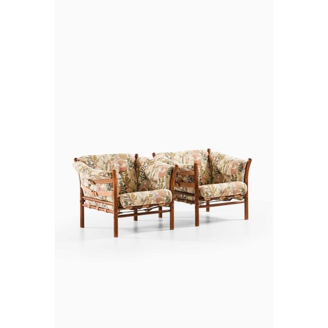 This rare pair of indra easy chairs, designed by arne norell and produced by arne norell ab in aneby, sweden, is a...