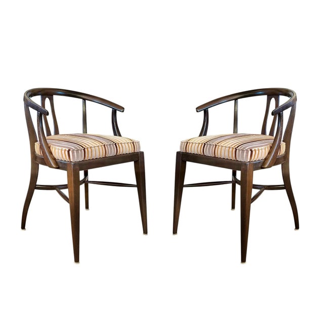 A sexy pair of 1960s walnut wishbone-form accent chairs perfectly sized for any space. With beautiful curves, a striking...