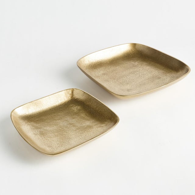 Modern, square forms, rounded corners and smooth texture make these cast aluminum trays unique. Line with a collection of...