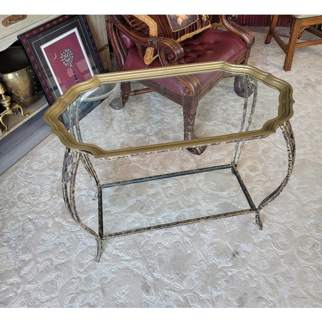 This vintage tray table blends functional design with the refined elegance of Hollywood Regency and Neoclassical style....