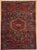 Antique hand-knotted runner from the Hamedan region of western Iran, featuring a bold geometric medallion design set on a...