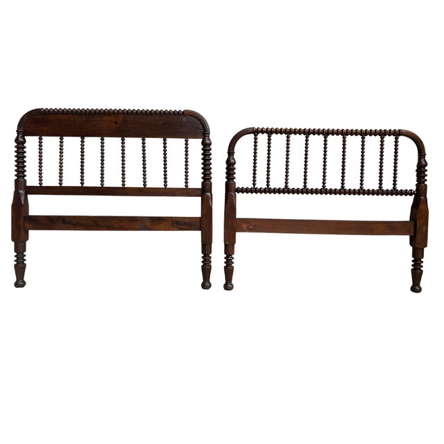 A rare matched pair of antique Jenny Lind (spool/spindle) twin headboard and footboard (could be used as a daybed). A...